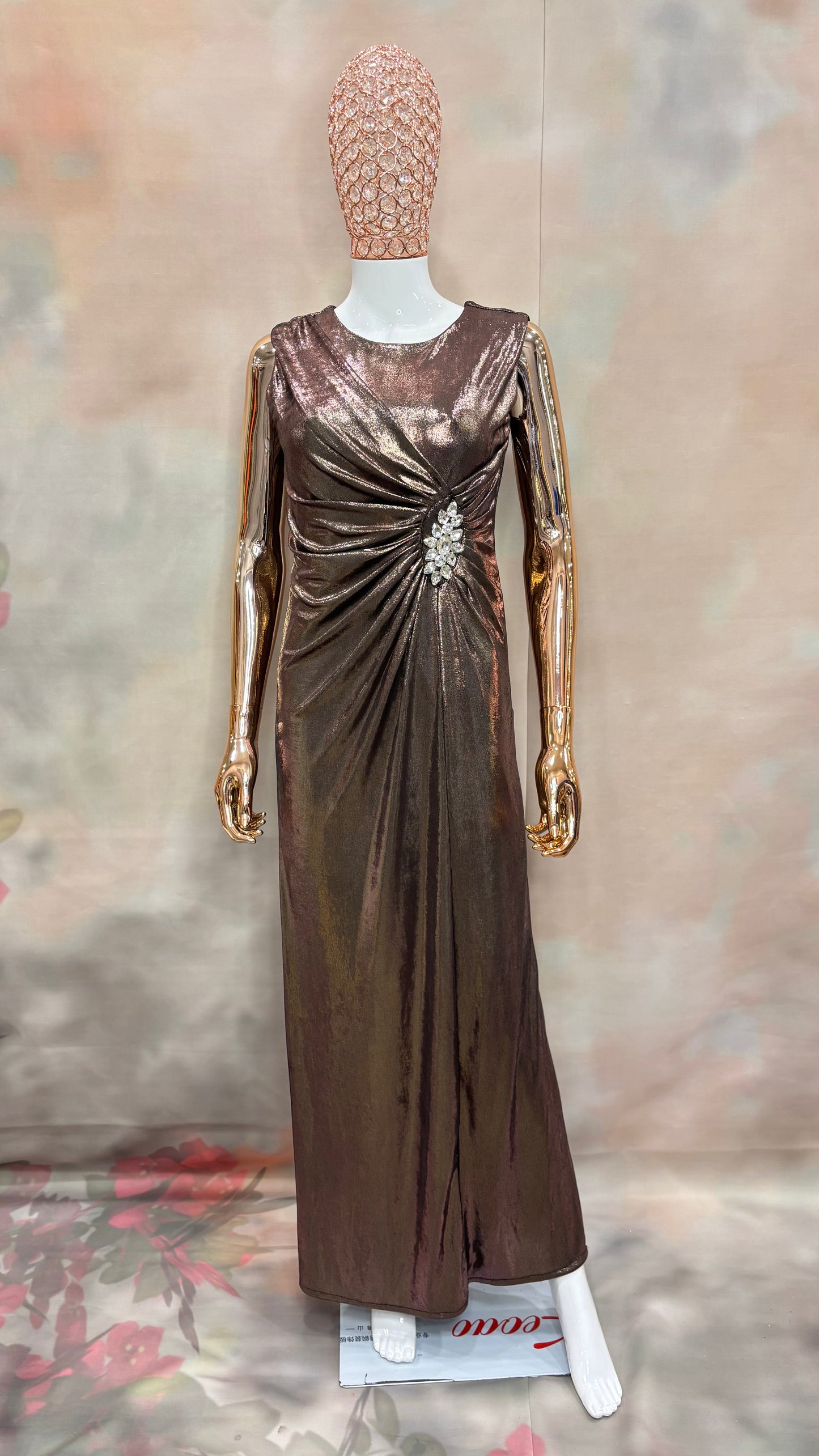 Bronzed Elegance – Metallic Drape Gown with Crystal Brooch Detail