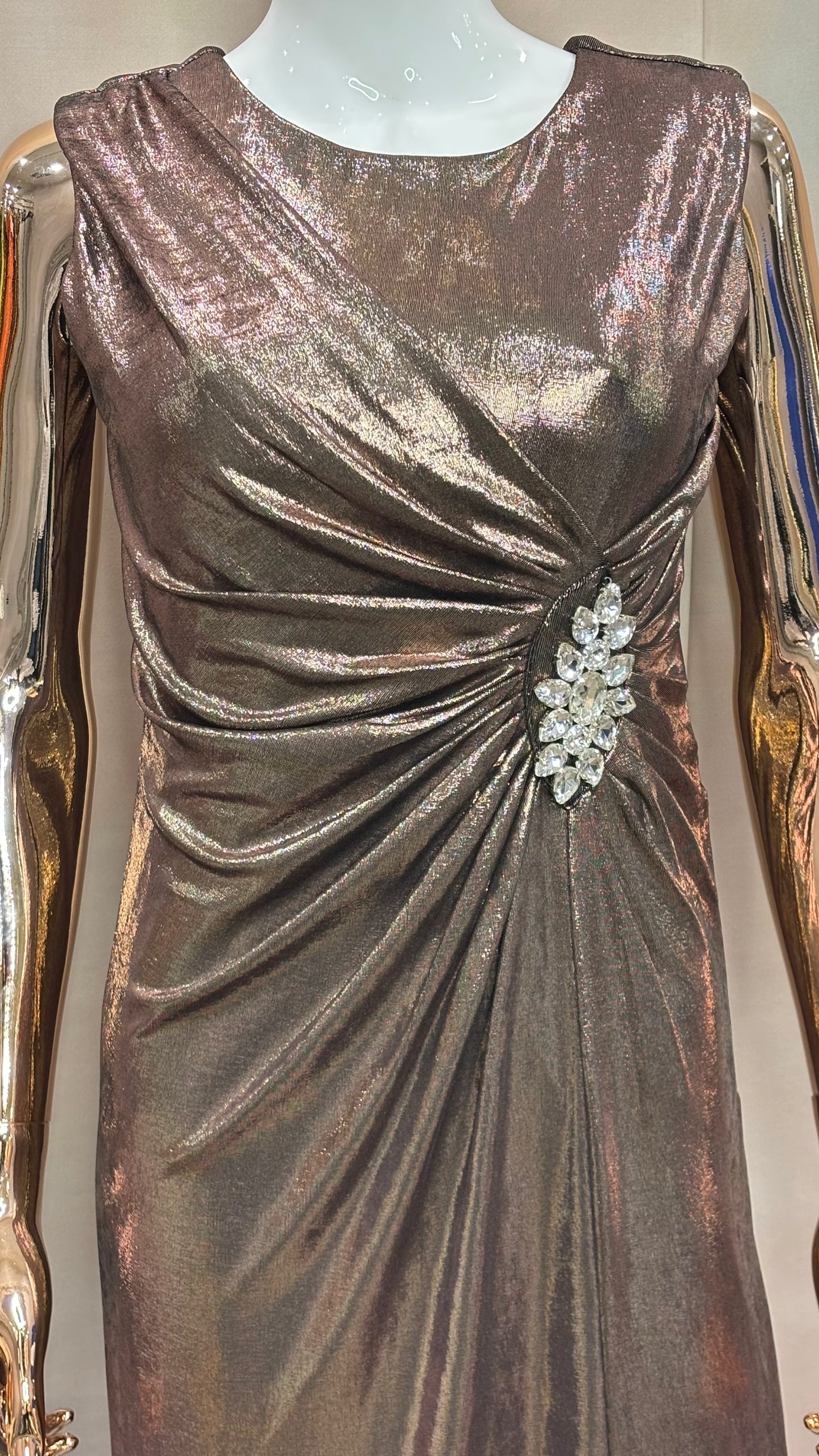 Bronzed Elegance – Metallic Drape Gown with Crystal Brooch Detail